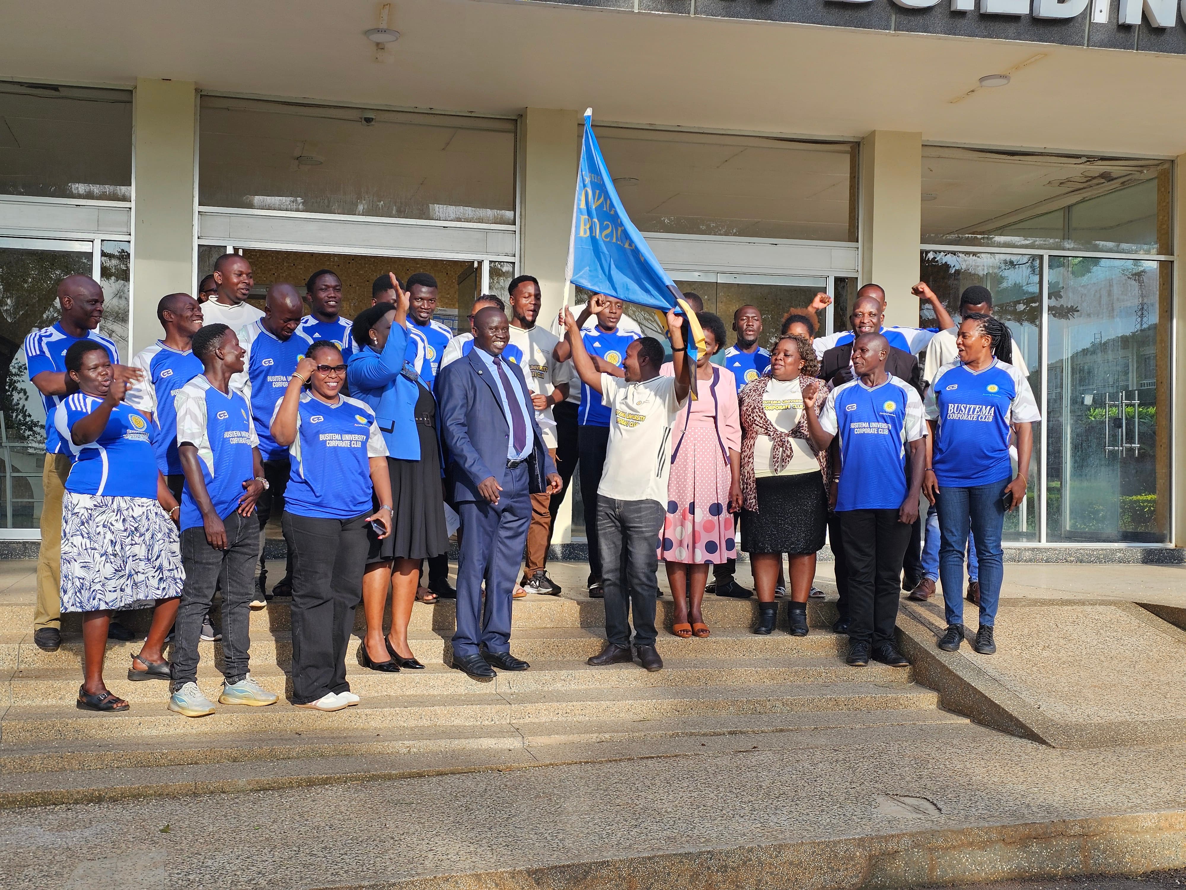 Members of the Busitema University corporate sports team cheer as the University flag is raised during the flag-off ceremony at Busitema Campus on 21 October 2026.