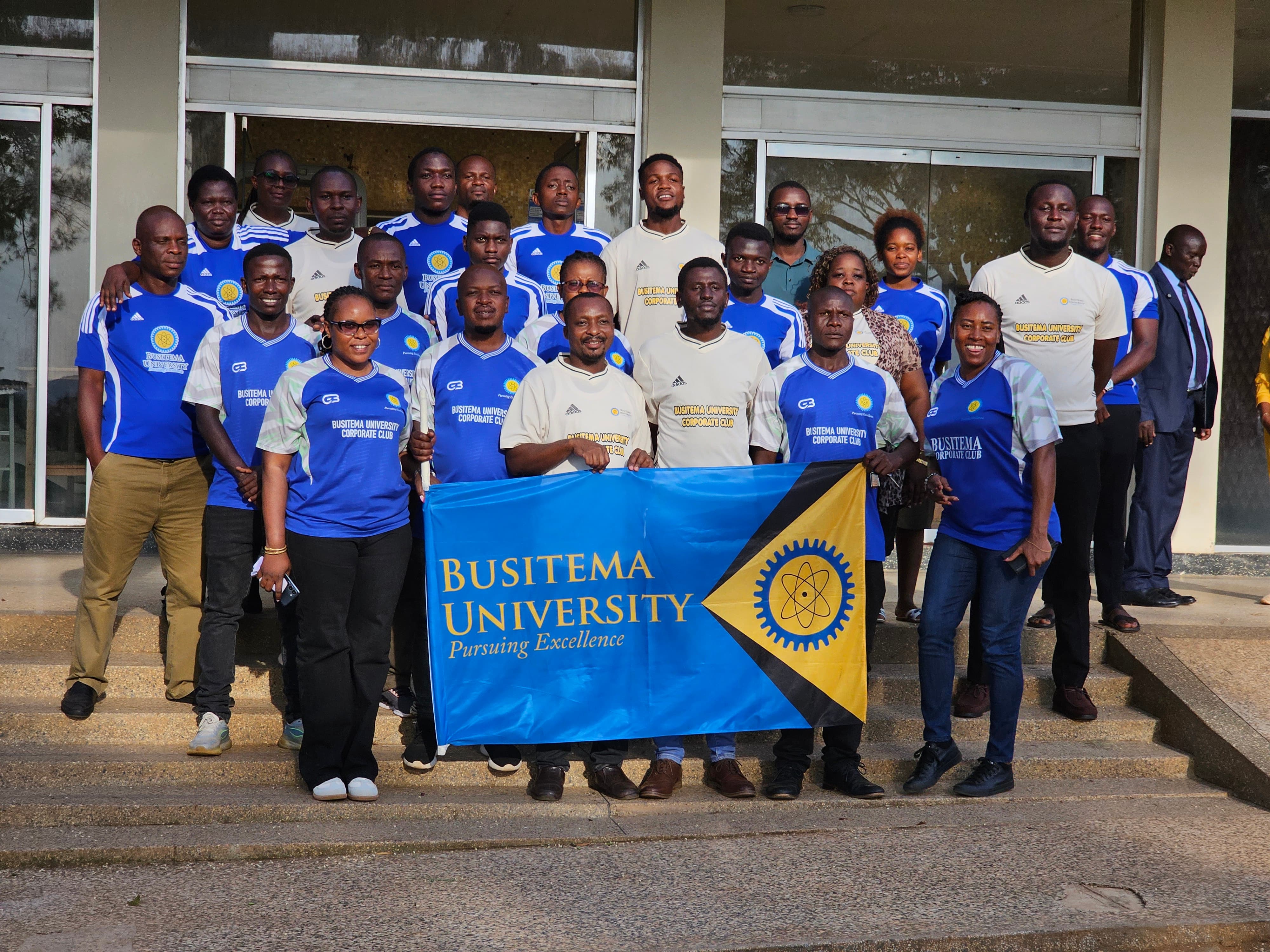Members of the Busitema University Corporate Team pose with the University flag at Busitema Campus on 21 October 2026, ahead of their departure for the Uganda National Corporates Tournament Western Edition in Kabale.