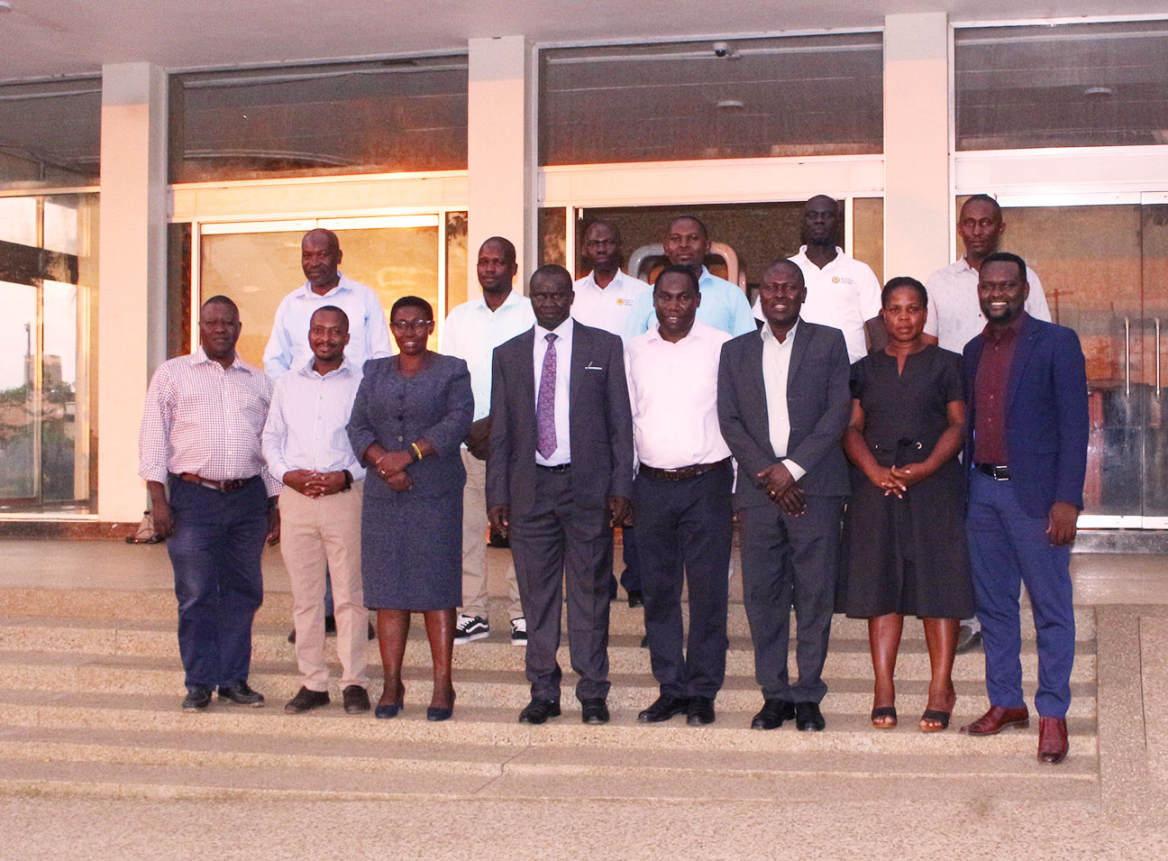 Vice Chancellor Prof. Paul Waako, members of Top Management and project leaders pose for a group photograph in front of the University Administrative Block following the engagement.