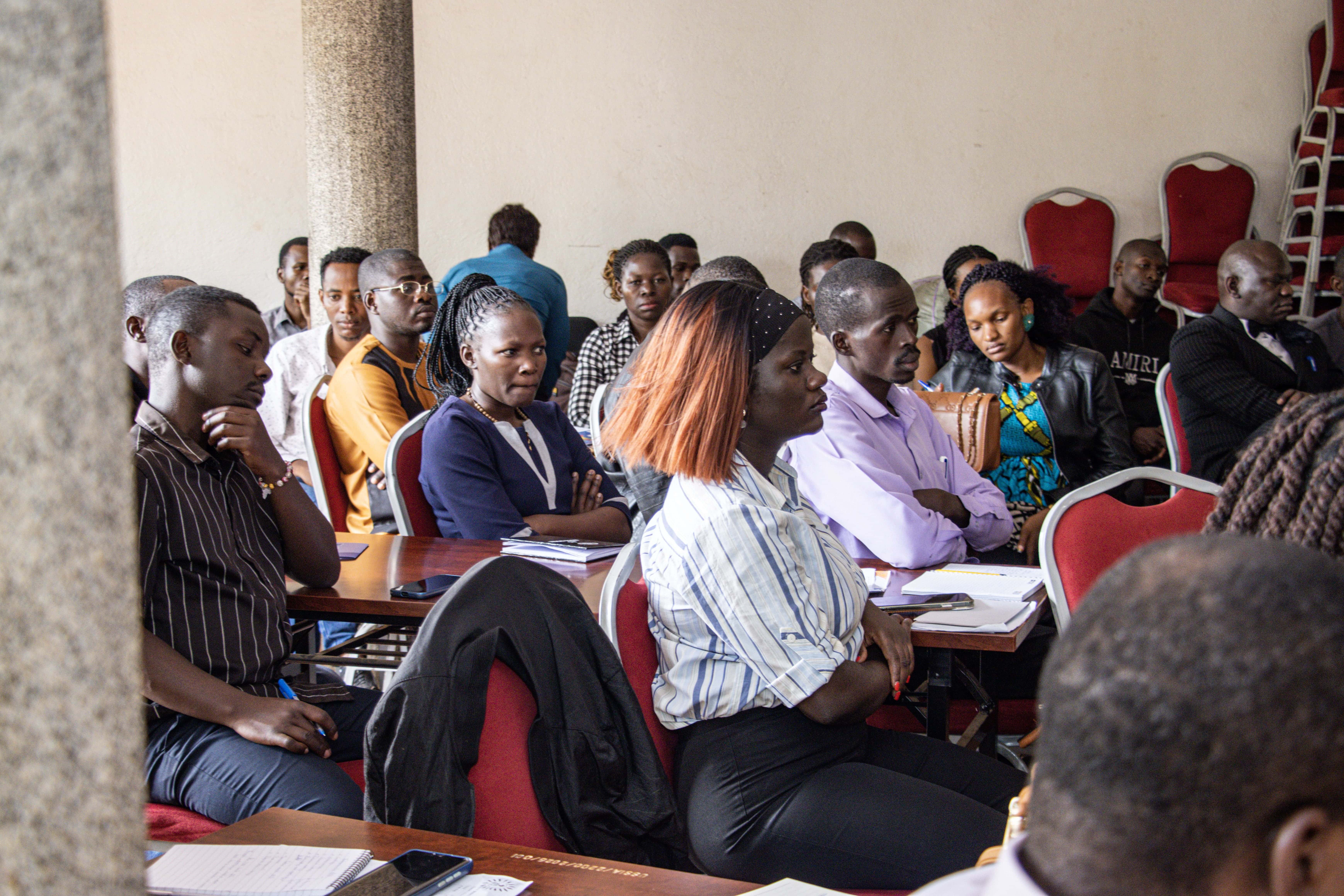 Participants attentively follow one of the training sessions during the Strengthening Inclusive TVET Teaching for Refugees and Host Communities in Uganda workshop
