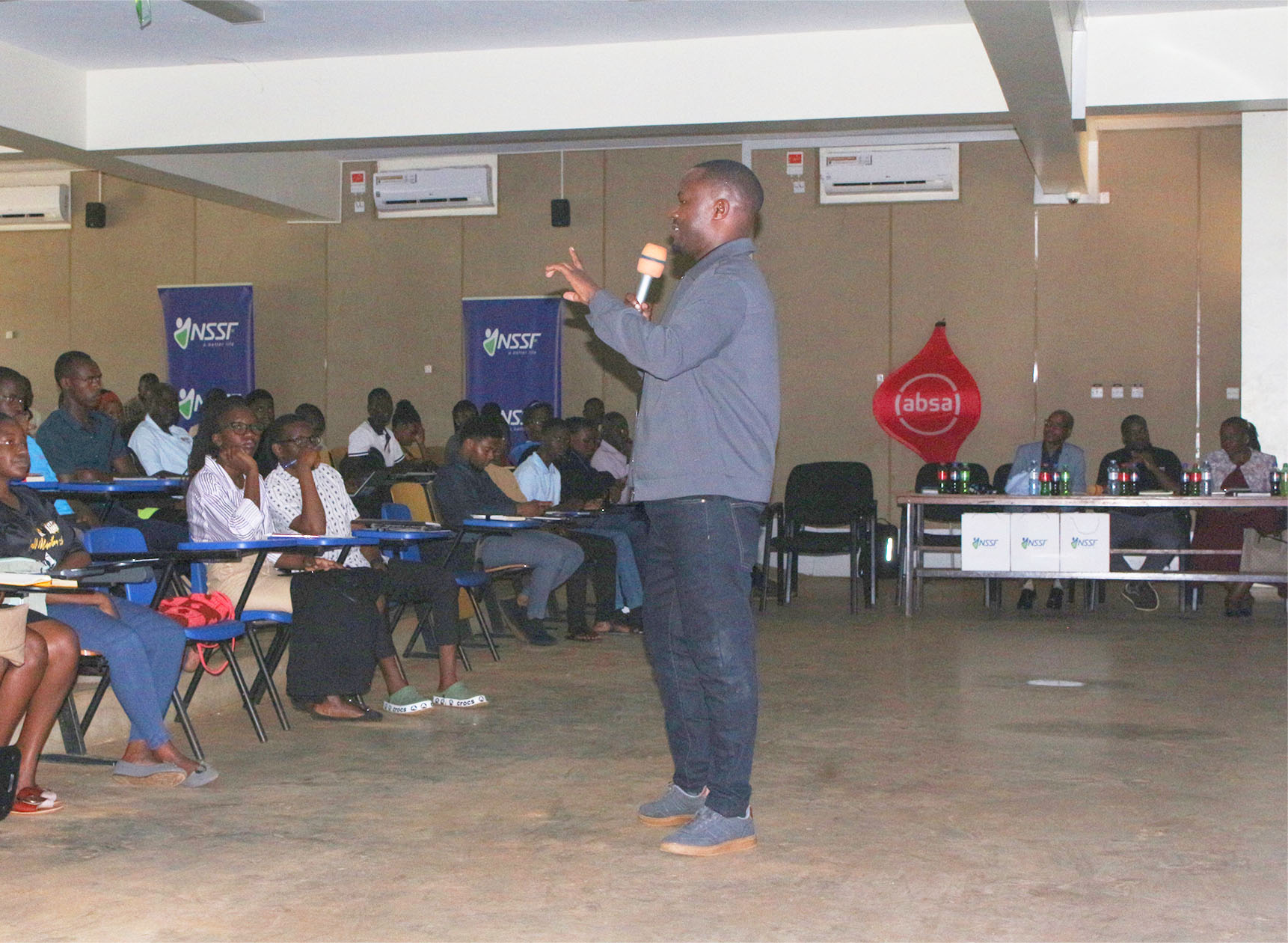 Mr. Kavuma Lamech, Chief Operations Officer at AI Studio Uganda, addresses students during the Expo
