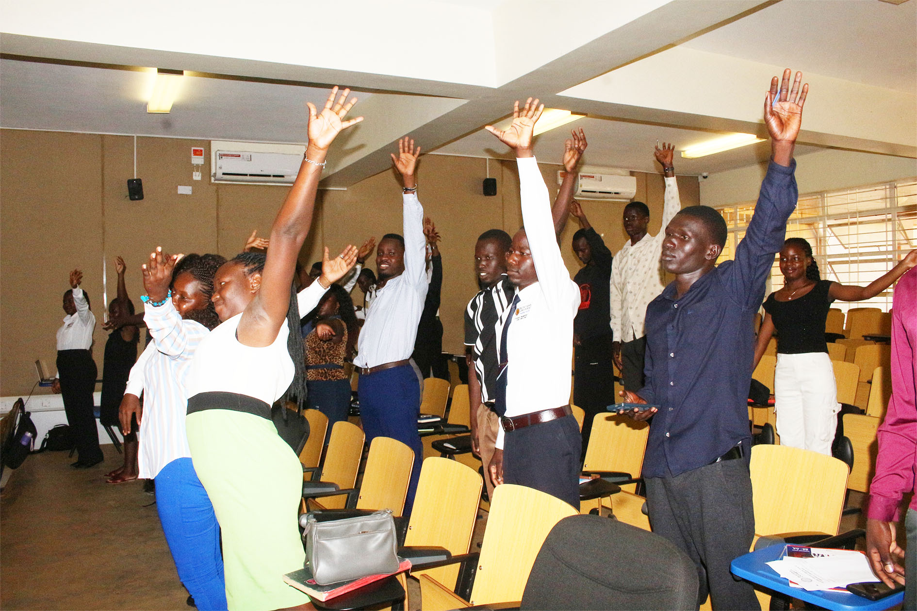 Participants take part in an interactive session during the self-care and health awareness training at Busitema Campus.