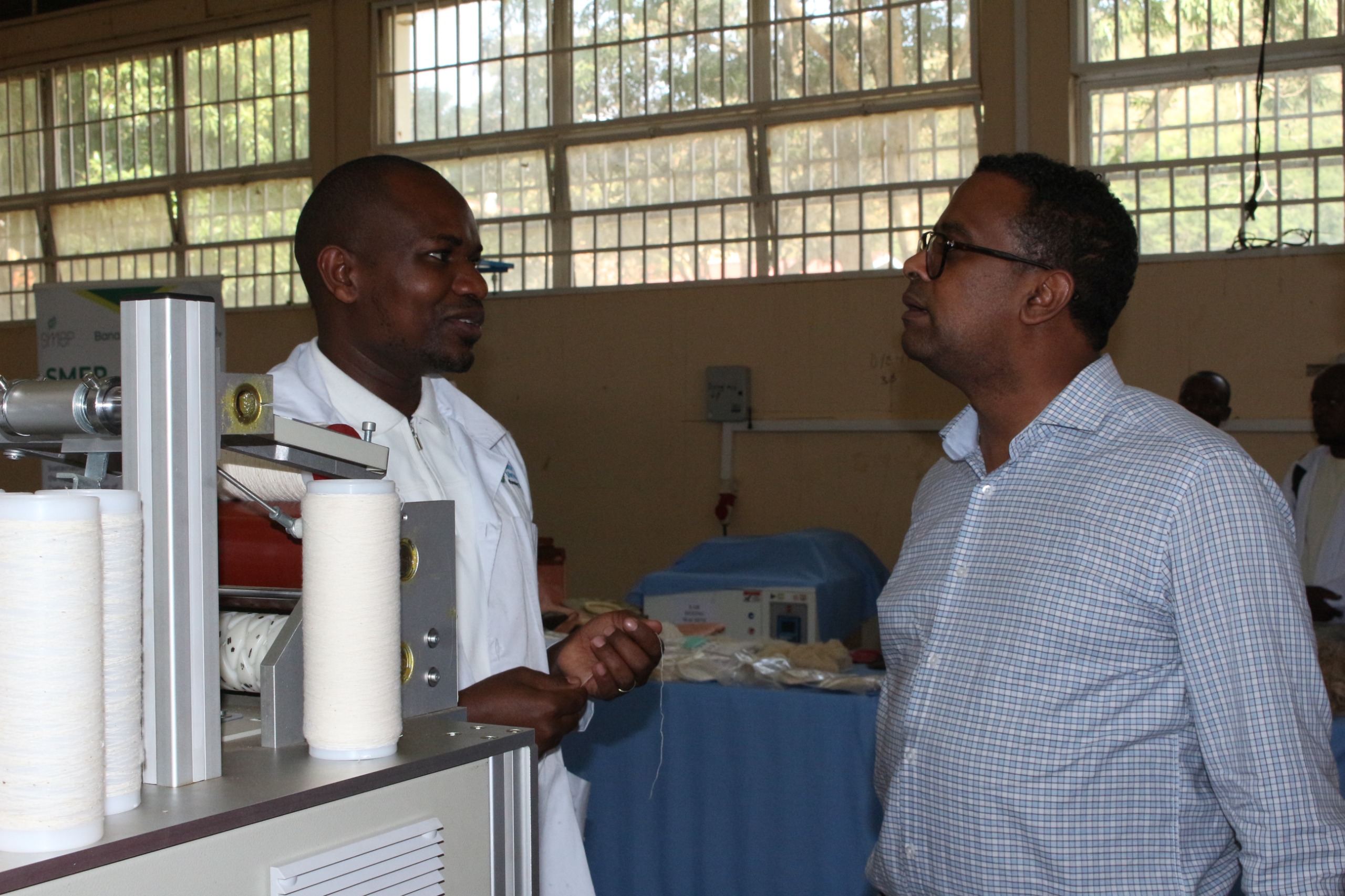 BANATEX-EA Project Team demonstrates banana fibre preparation and spinning to Mr. Redda during a tour of the newly established banana fibre spinning laboratory
