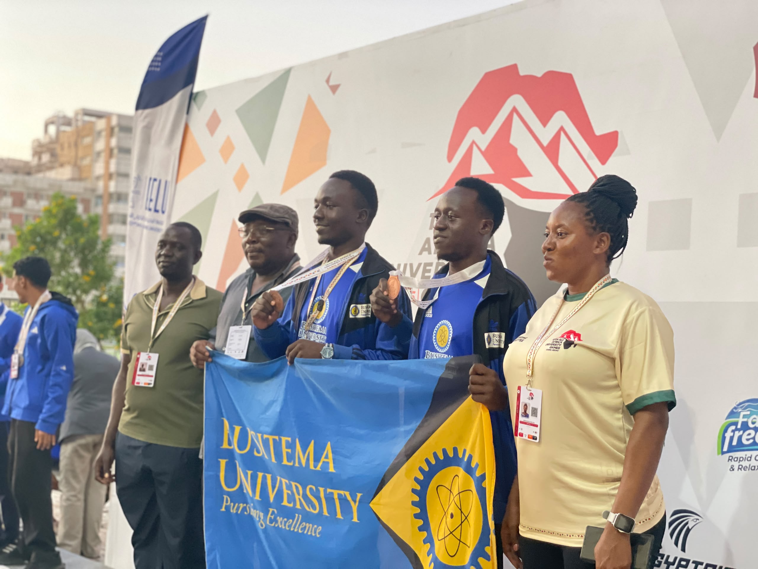 Busitema University’s bronze medal-winning chess team with Dean of Students Mr. Joseph Wanyama (second left) and Deputy Chief of Sports Dr. Agnes Baluka Masajja (right) in Cairo