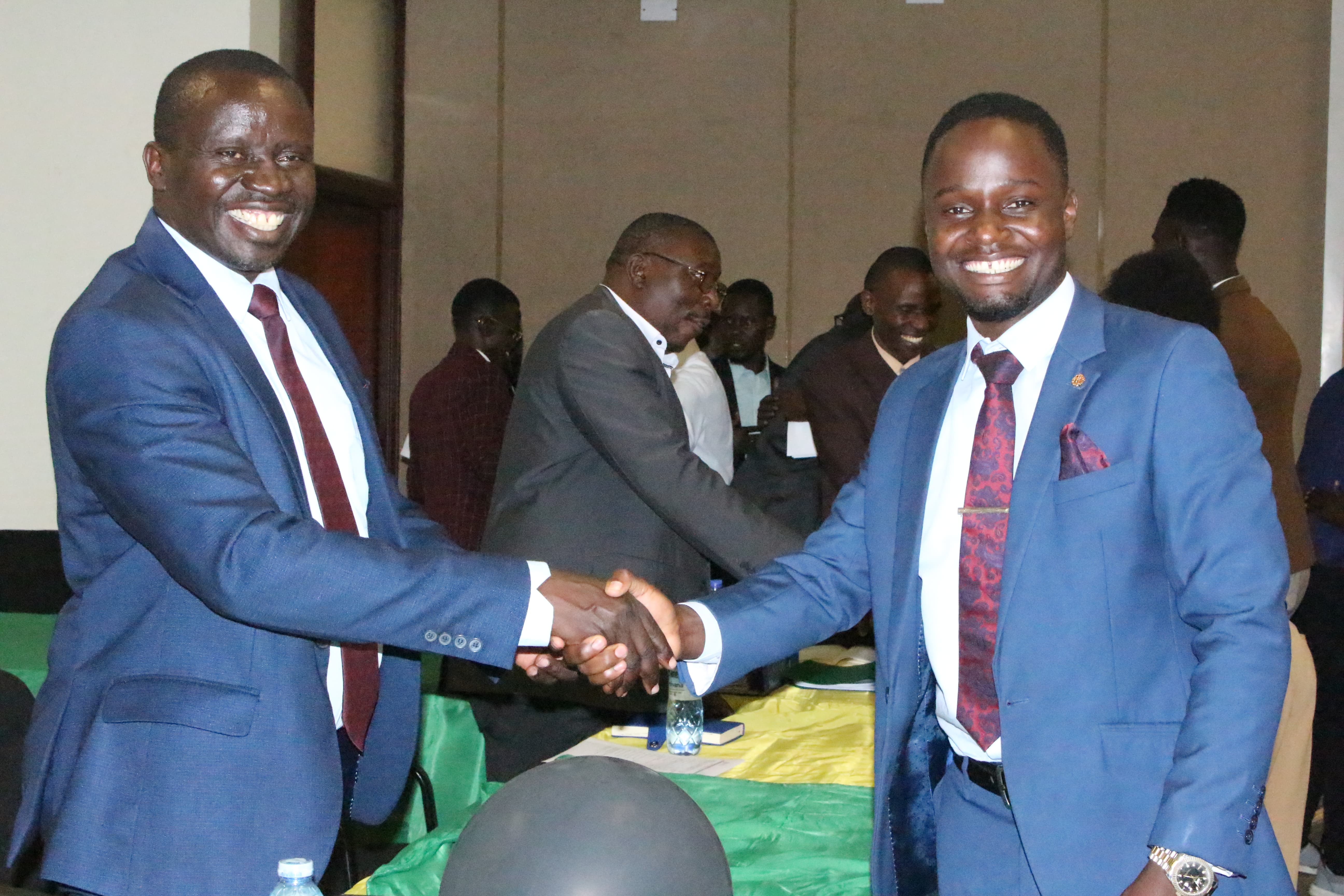 The Vice Chancellor, Prof. Paul Waako shakes the hand of one of the newly elected Guild Leaders during the ceremony