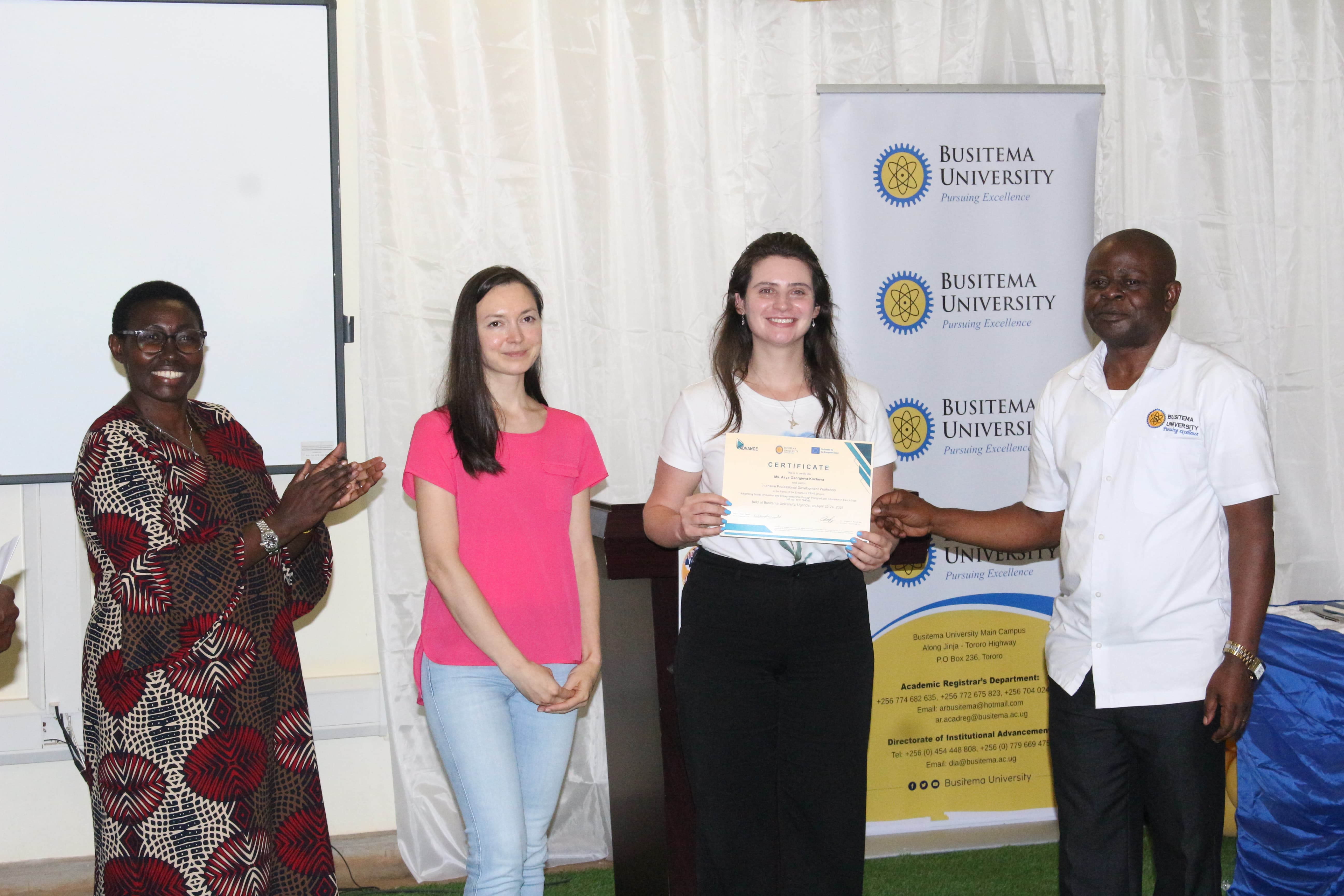A trainee from Europe is awarded a certificate of attendance