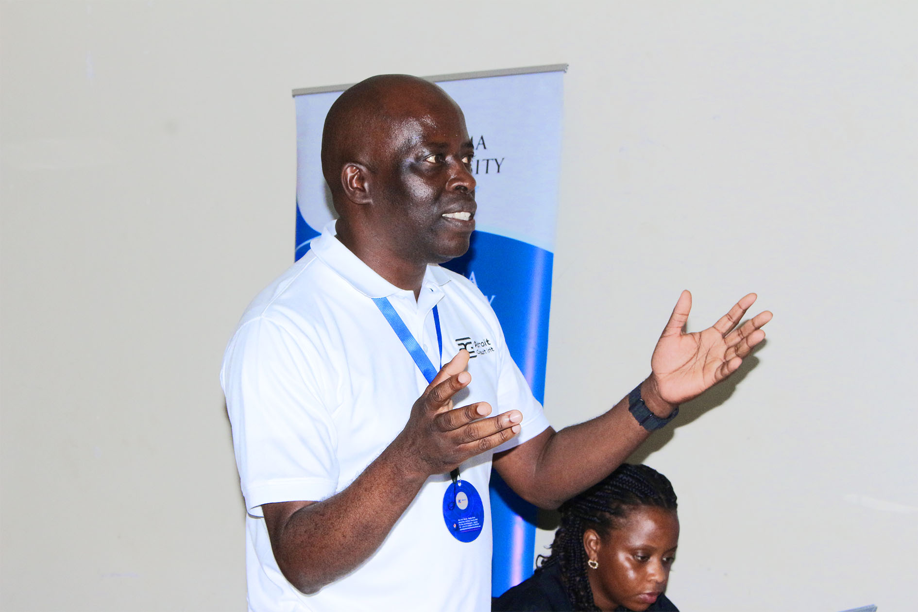 Mr. Moses Asasiira addresses participants during the assessment visit at Busitema University.