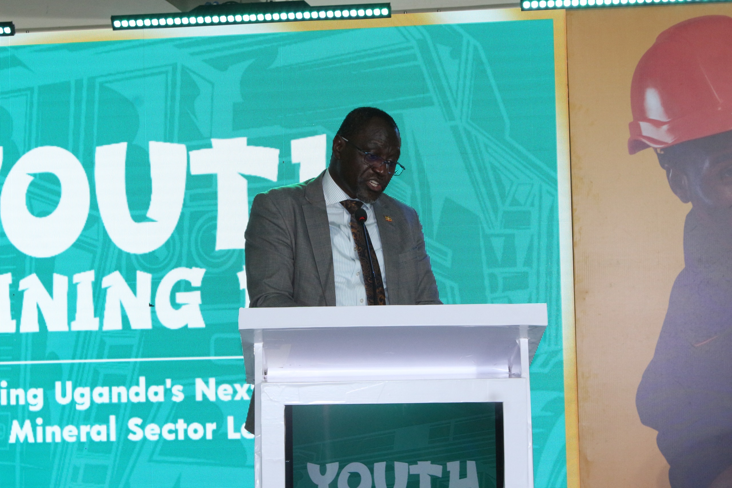 Eng. Samuel Okodi, representing the Ministry of Science, Technology and Innovation under the Office of the President, addresses participants during Youth Mining Day at Busitema University Main Campus on 14 August 2026.