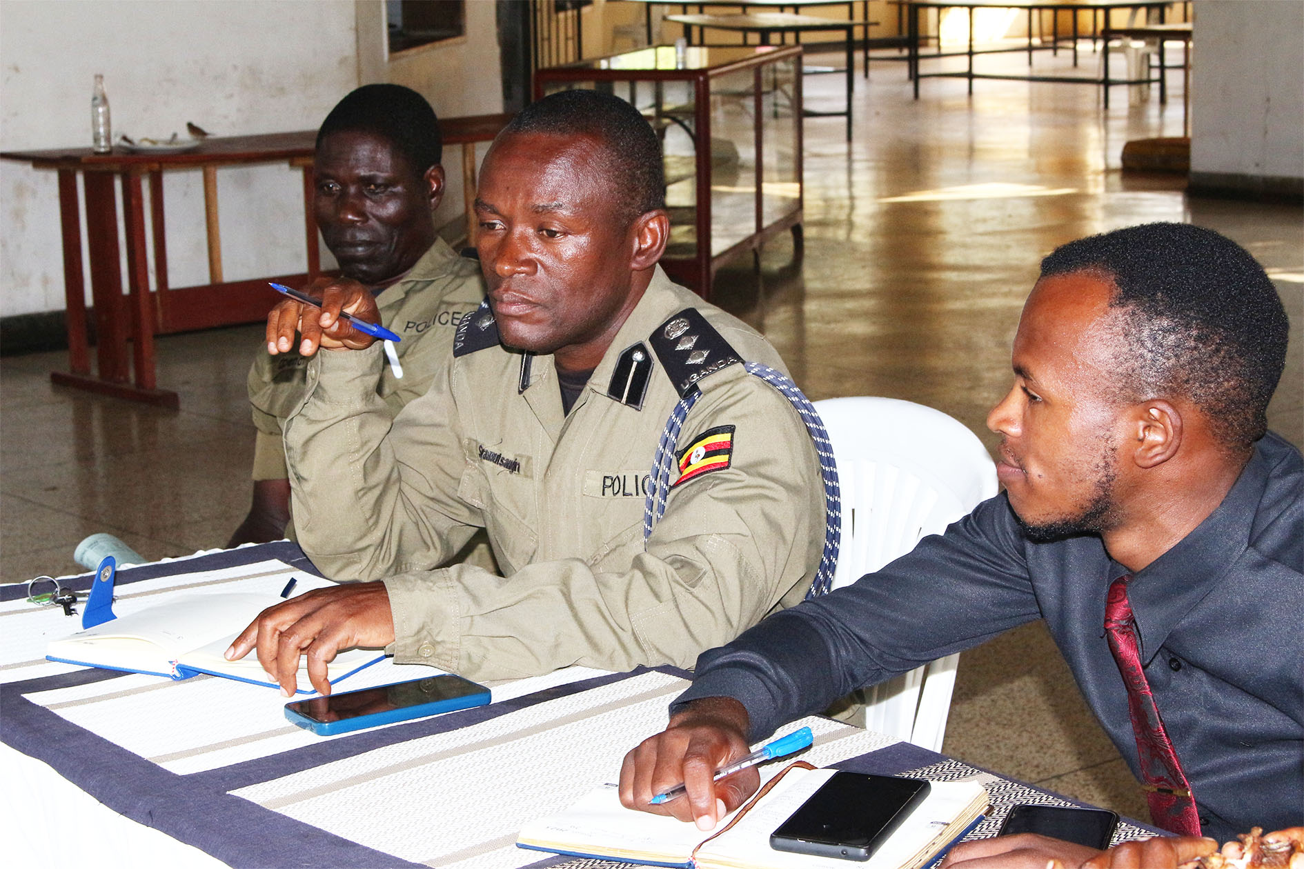 Chief Security Officer, SSP Syamutsangira Simon, addresses the meeting as the Guild President and Operating Commissioner follow the proceedings