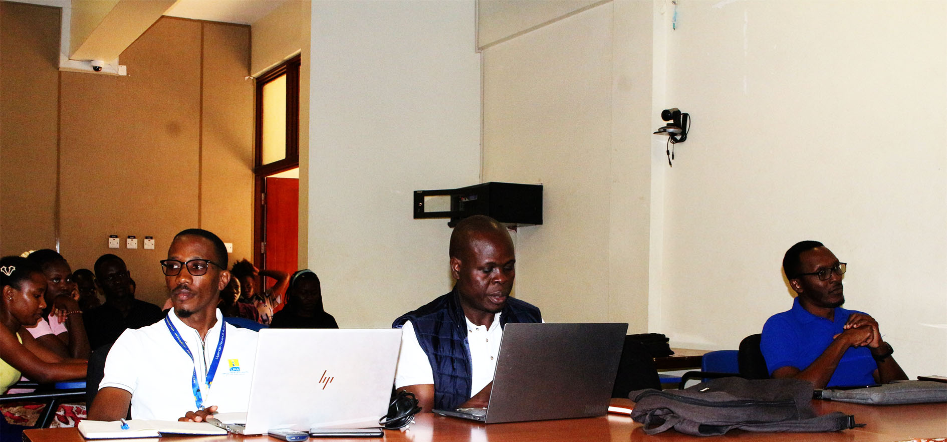 L–R: Mr. Godwin Akiza (URA), Mr. Jonah Waiswa (Bank of Uganda), and Mr. Collin Agaba (UCC) attend the student engagement.