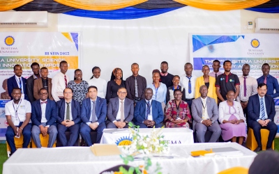 Professor Paul Waako (seated fifth from left) and Dr. Yasin Nawab (seated fifth from right) pose for a group photo with delegates during the event