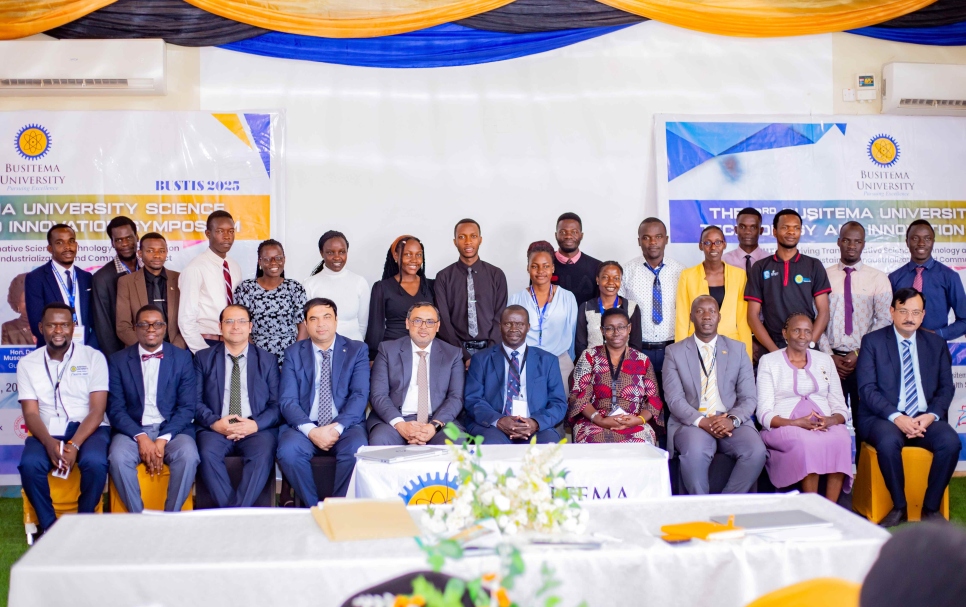 Professor Paul Waako (seated fifth from left) and Dr. Yasin Nawab (seated fifth from right) pose for a group photo with delegates during the event
